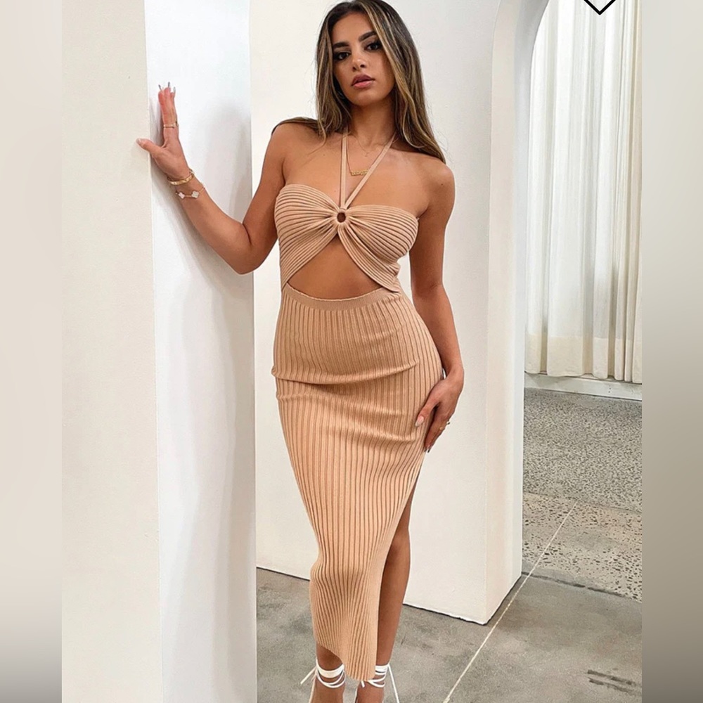 Brand new with Tag cut out dress size small in brown . High slit